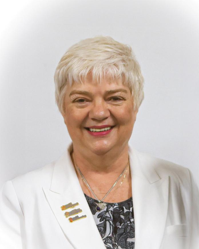 Charmaine Hooper is smiling at the camera
