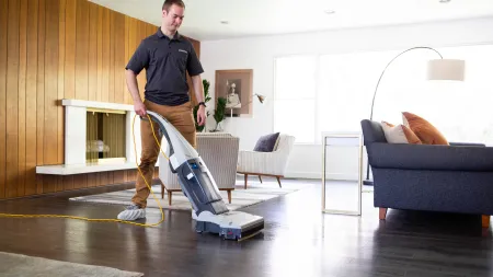 a man with a vacuum
