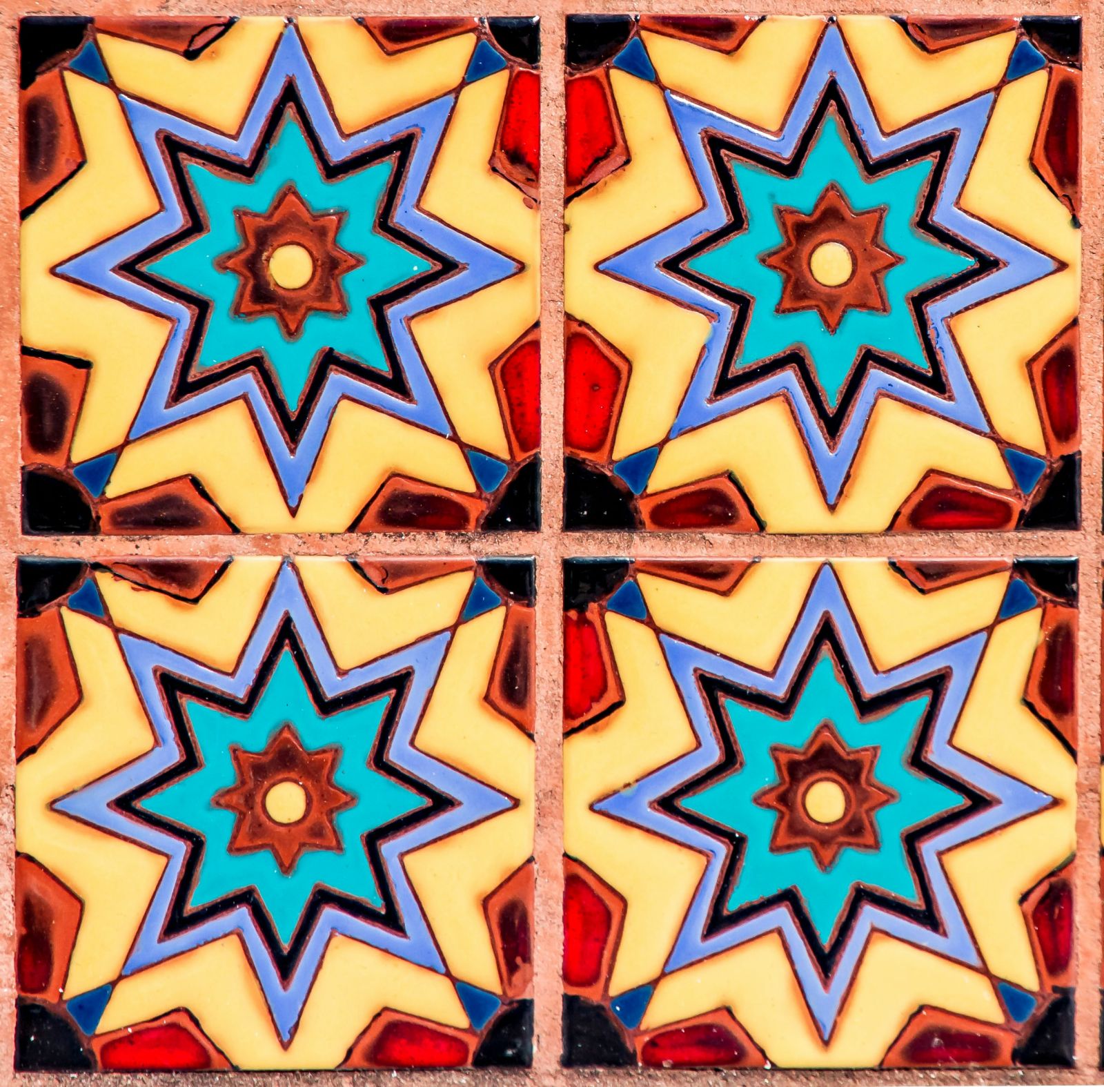 bright orange tiles with orange cracking grout between them